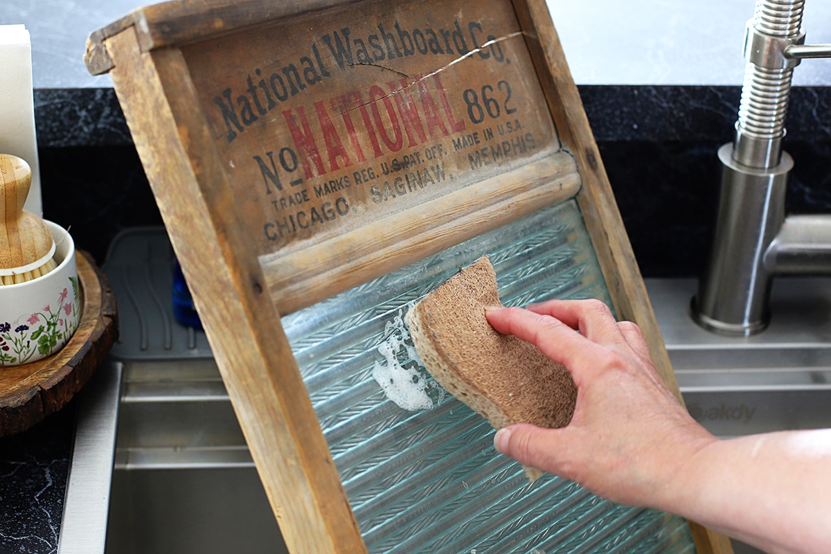 Washing aa vintage wooden washboard so it can be used in a rustic tablescape.