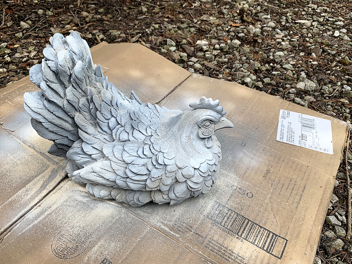 Painting putdoor yard art using the faux cement technique.