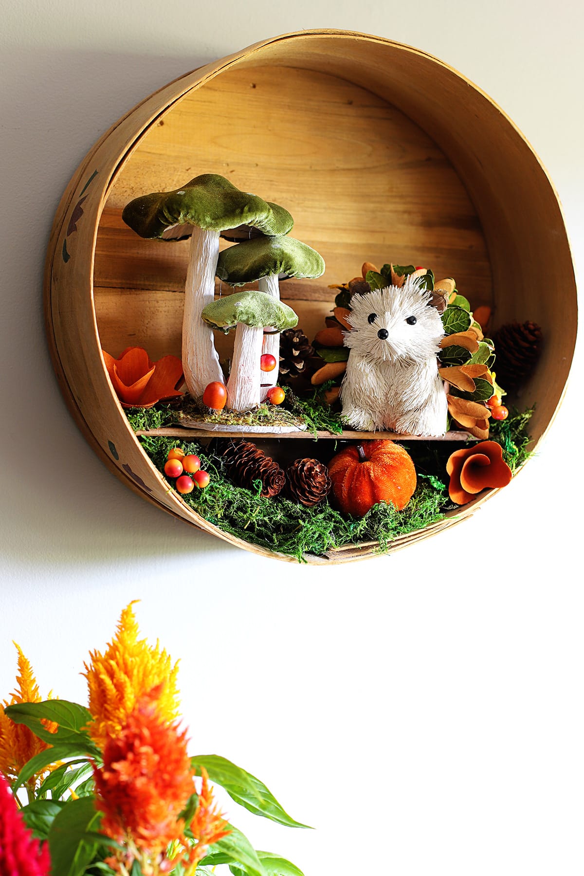 Learn how to transform a vintage round cheese box from the thrift store into a beautiful fall wreath with this easy DIY project. Perfect for adding rustic charm to your autumn decor!