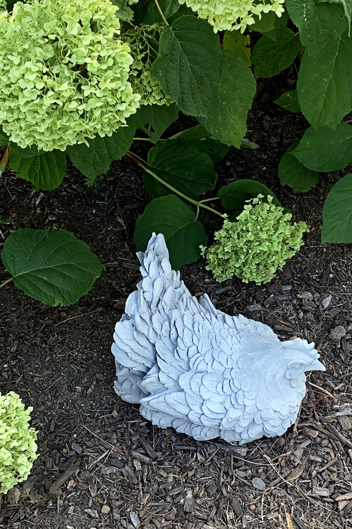 Learn how to make faux concrete garden decorations and statues by upcycling old home decor pieces. Follow our step-by-step guide to transform thrift store finds into eco-friendly garden art.