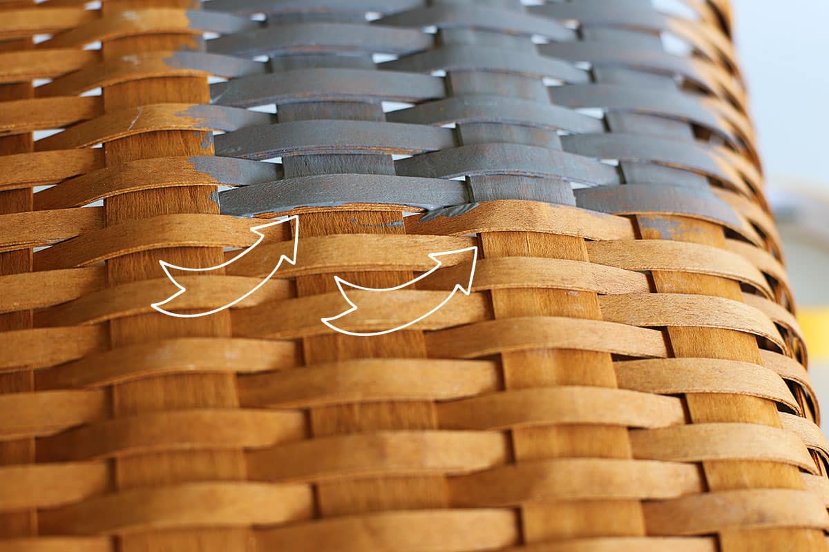 Showing details of painting under the splints of the basket so all the visual area is painted.