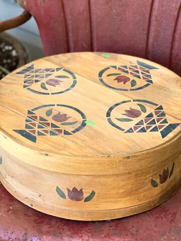 Repurposing a round vintage wooden cheese box into a fall wreath.