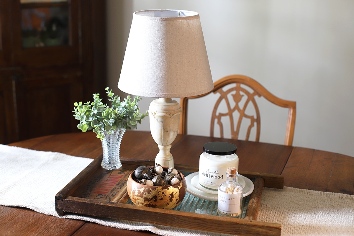 Repurposing a vintage wood and glass washboard into a rustic table centerpiece.