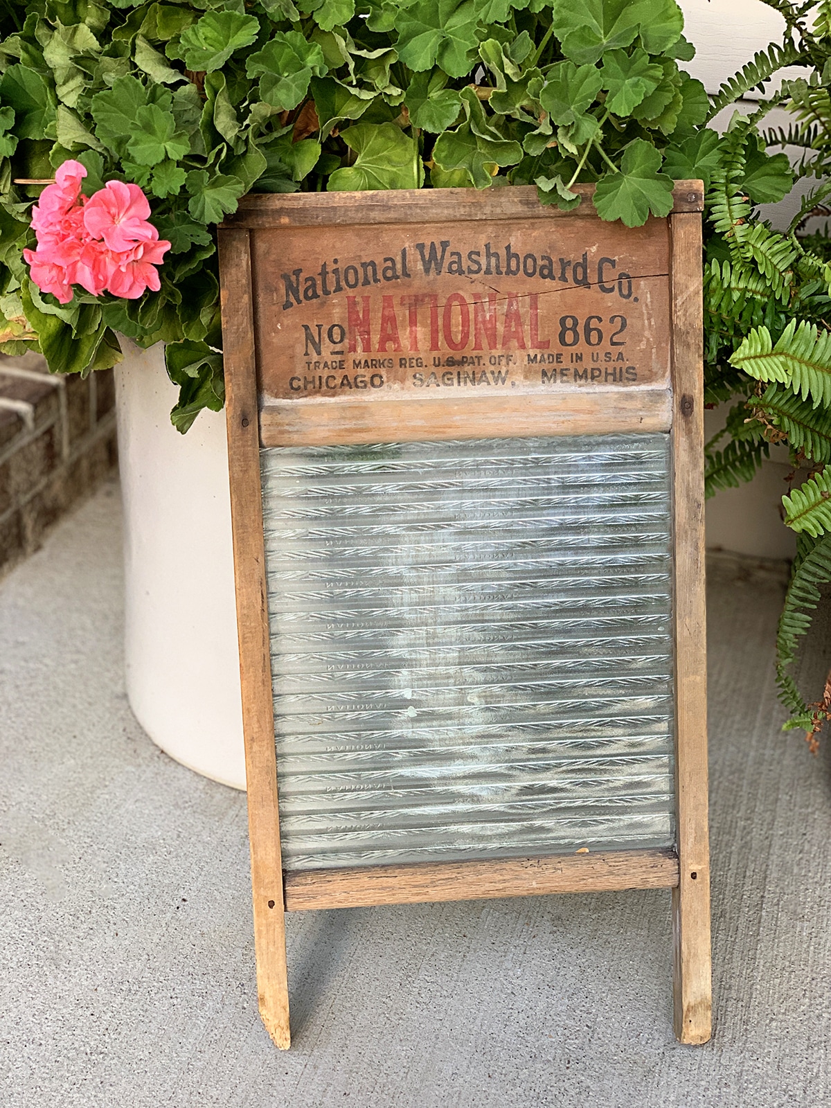 Repurposing a damaged vintage wooden washboard from the National Washboard Company into a rustic table centerpiece.