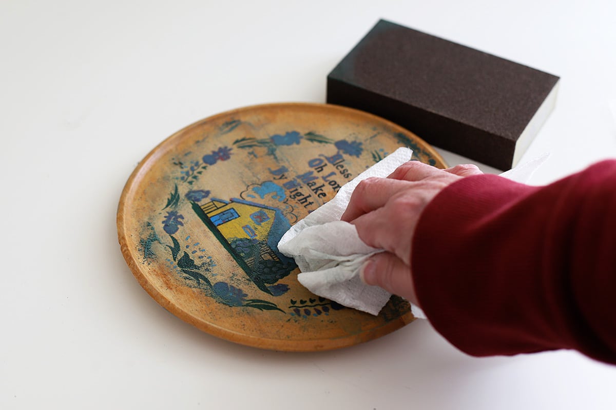 Sanding a vintage plaque which will be turned into a cath-all tray.