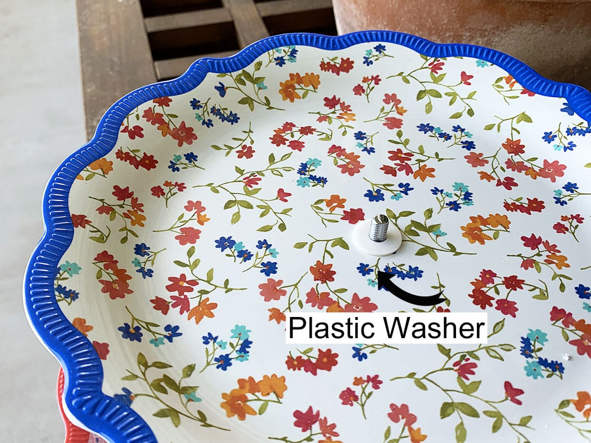 Put another plastic washer on top of the plate.
