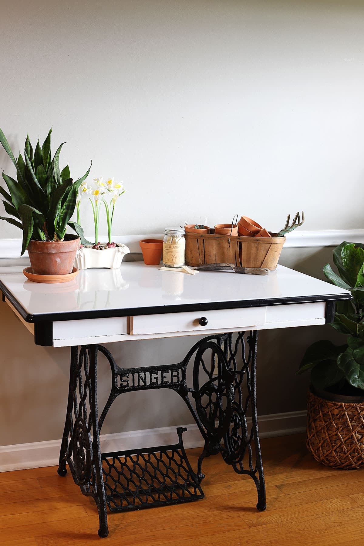 Vintage enamel kitchen table combined with a Singer sewing machine base.
