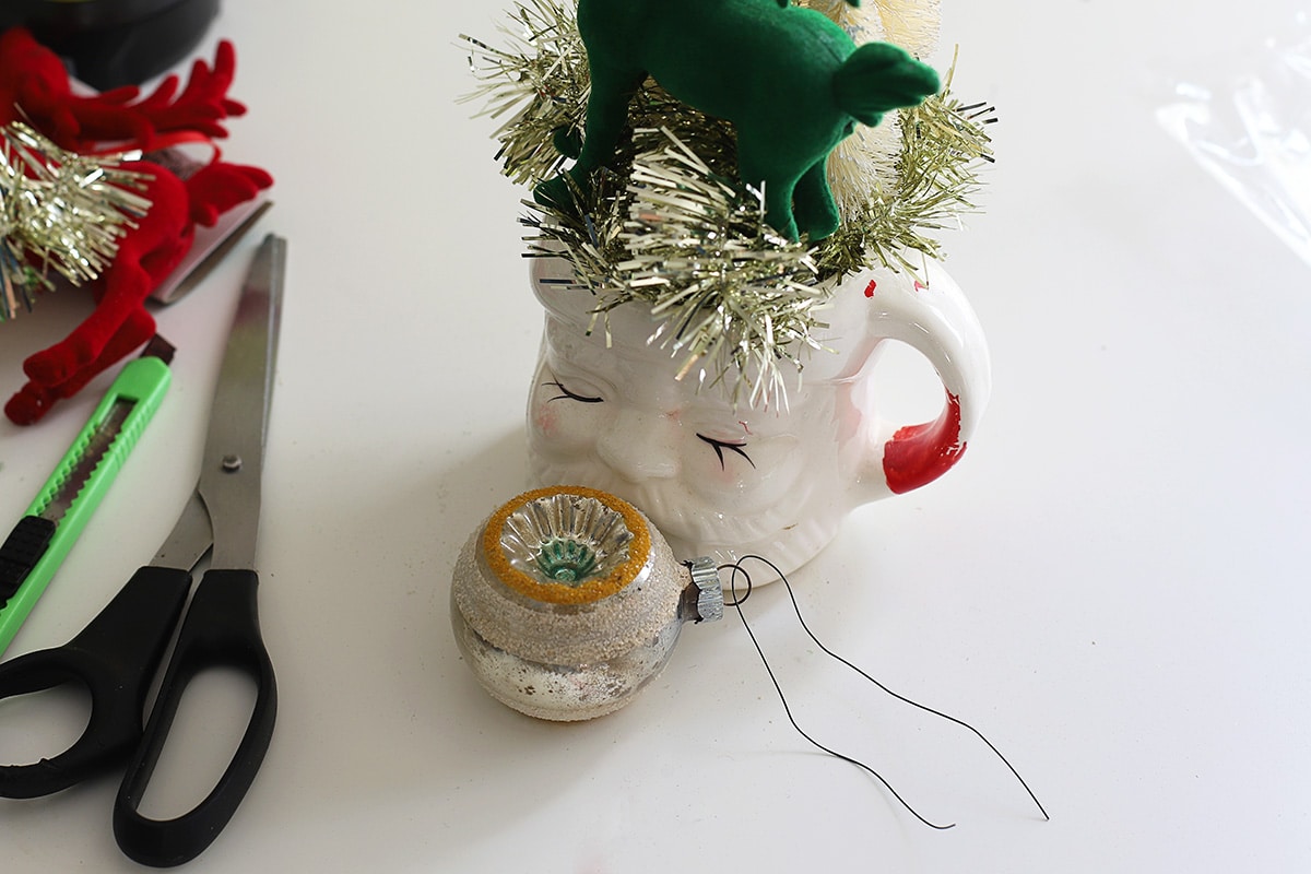 Vintage Shiny Brite ornament used in a assemblage art project for Christmas.