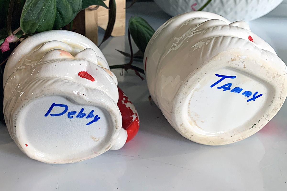 The bottoms off the Christmas Santa mugs with handwritten names on the children on them.