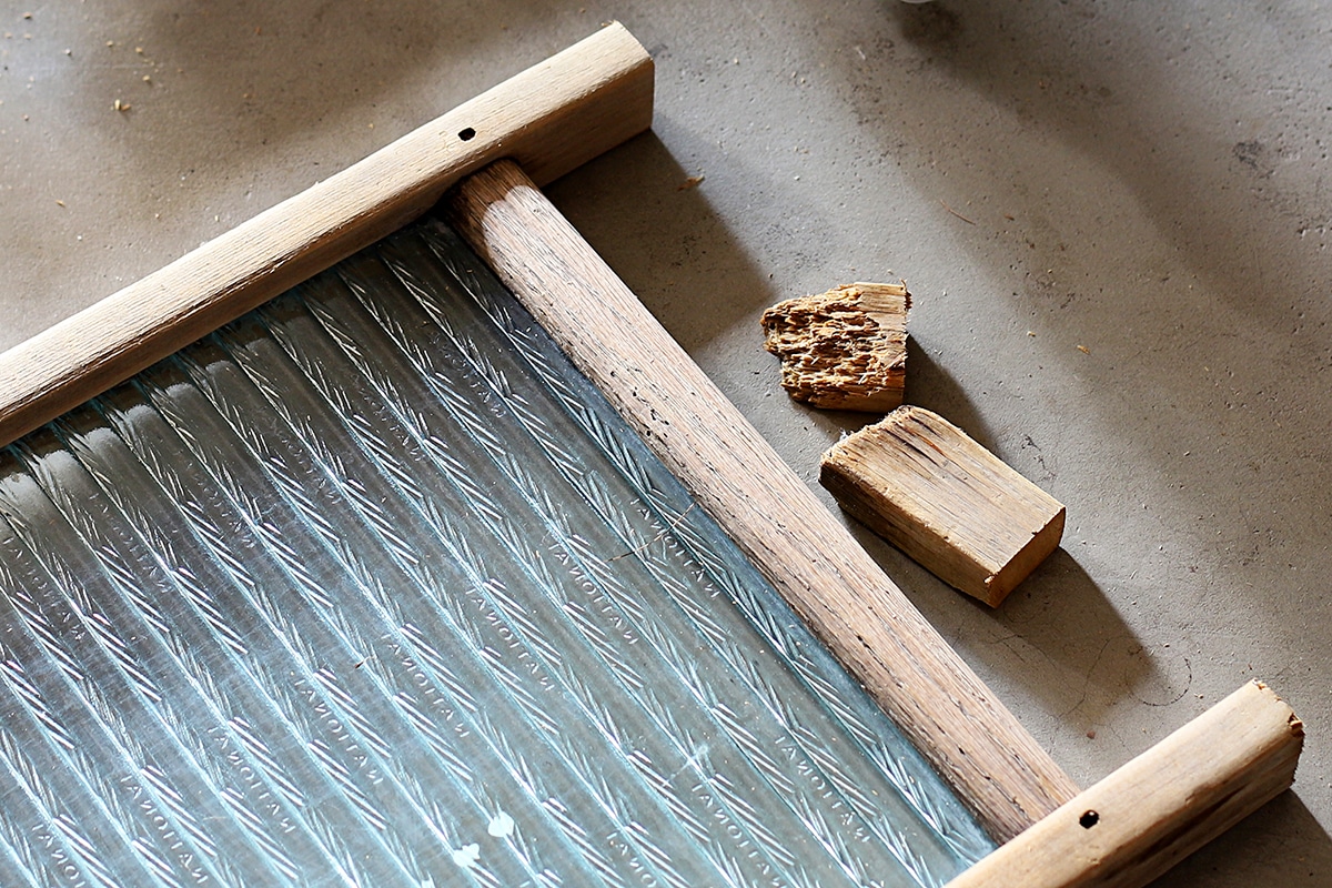 Cutting off parts of the washboard legs in order to even out the legs.